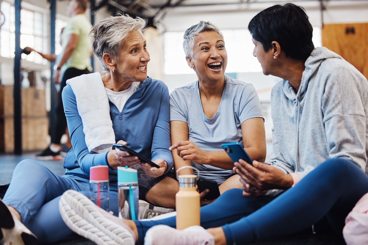 Freinds Smiling and Laughing Doing Yoga